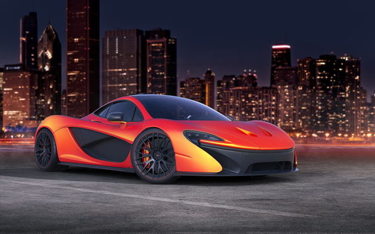 Обои на рабочий стол Спортивный автомобиль марки McLaren P1, стоит на дороге на фоне ночного города