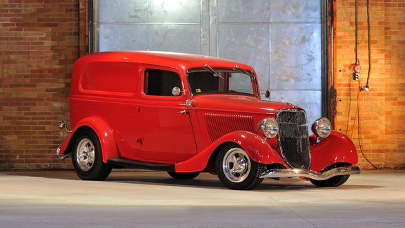 Обои на рабочий стол Красный автомобиль марки Ford V-8 Model BB-85 Deluxe Panel Truck стоит в гараже