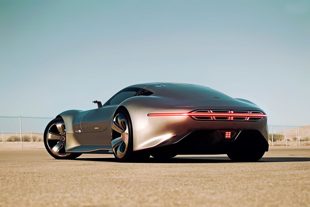 Обои для рабочего стола Серебристый автомобиль марки Mercedes-Benz AMG Vision Gran Turismo, стоит на дороге позади забора сетки на фоне синего неба