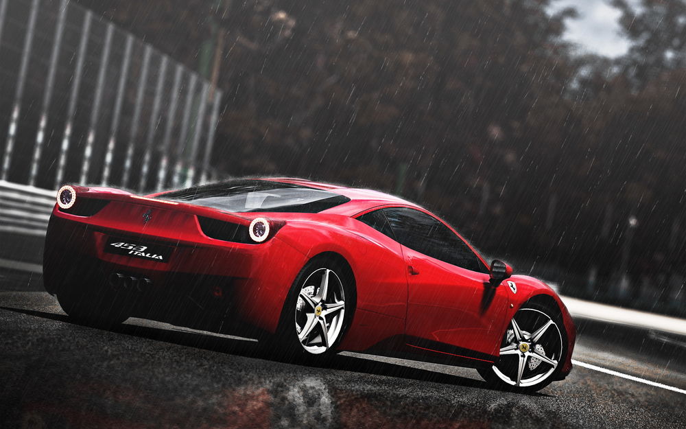 Обои для рабочего стола Красный автомобиль марки Ferrari 458 Italia, стоит на дороге под проливным дождем