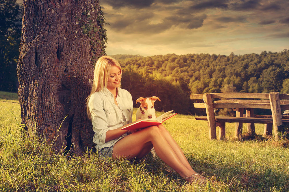 Обои для рабочего стола Девушка со щенком и книгой сидит у дерева, by Milenko Dilas