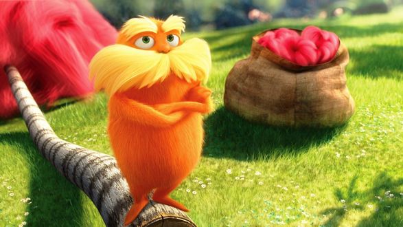 Обои на рабочий стол Dr. Seuss’ The Lorax / Лоракс Доктора Сьюза, мультфильм, его персонаж Лоракс, усатый оранжевый дух леса, рядом на траве мешок с плодами