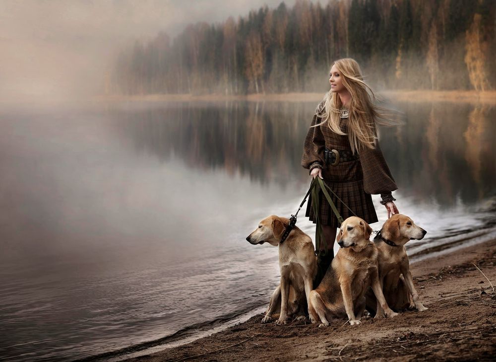 Обои для рабочего стола Девушка с тремя собаками на фоне водоема в легкой дымке и осеннего леса, by Elena Shumilova