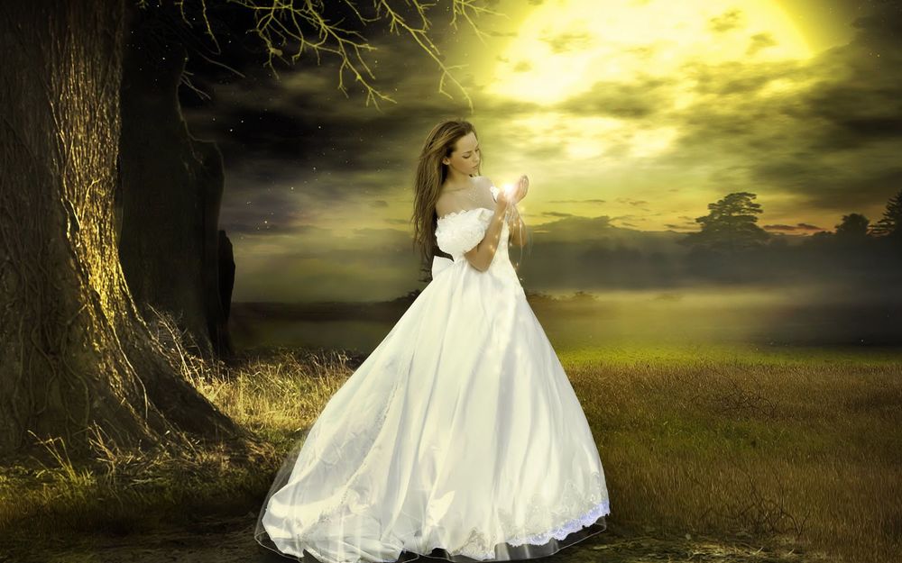 Обои для рабочего стола Девушка в белом длинном платье с магией в руках на фоне природы