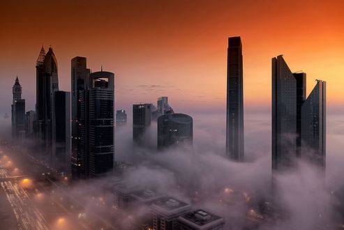 Обои на рабочий стол Небоскребы города Дубай в утреннем тумане в ОАЭ (Dubai, AUE)