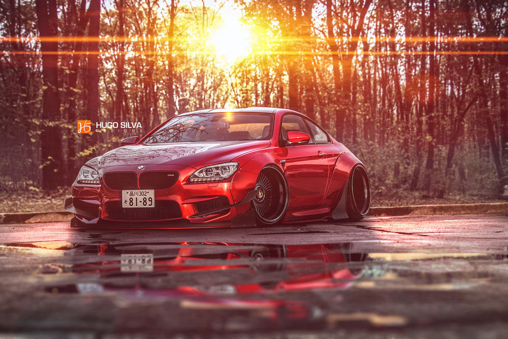 Обои для рабочего стола Красный bmw m6 стоит на дороге, на фоне деревьев