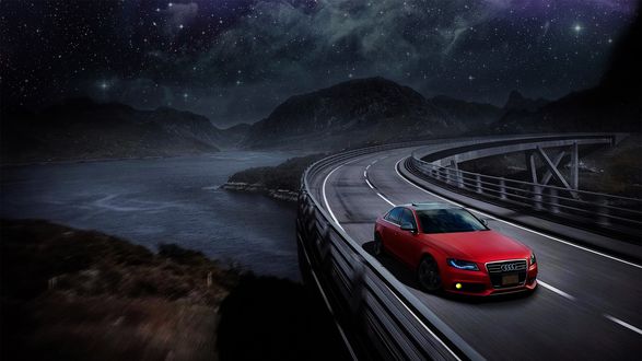 Обои на рабочий стол Красный Audi едет по дороге, на заднем плане горная река под звездным небом