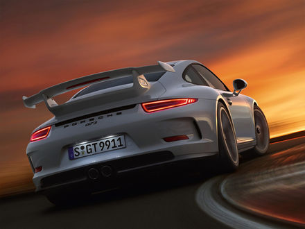 Обои на рабочий стол Porsche 911 / Порше 911 мчится по треку на закате дня