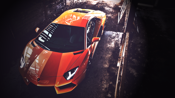 Обои на рабочий стол Оранжевый Lamborghini в полумраке