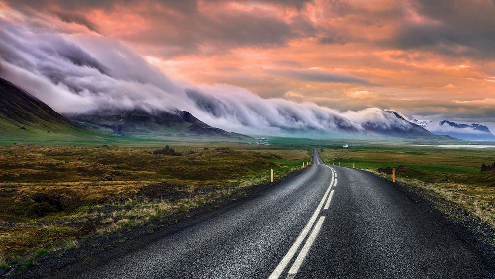 Обои для рабочего стола Дорога мимо гор, окутанных туманом, Исландия / Iceland, by wim denijs