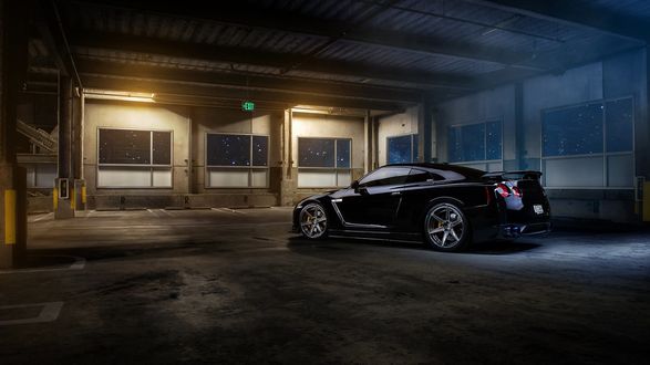 Обои на рабочий стол Черный Nissan GT-R ночью на парковке
