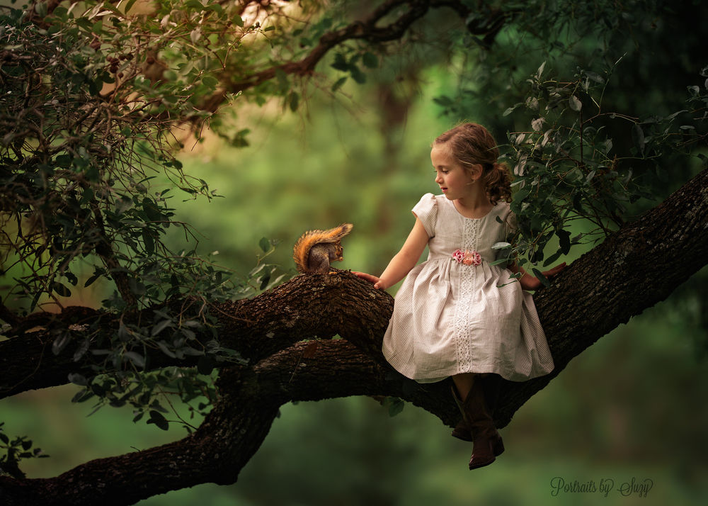Обои для рабочего стола Девочка сидит на ветке дерева рядом с белкой, by Suzy Mead