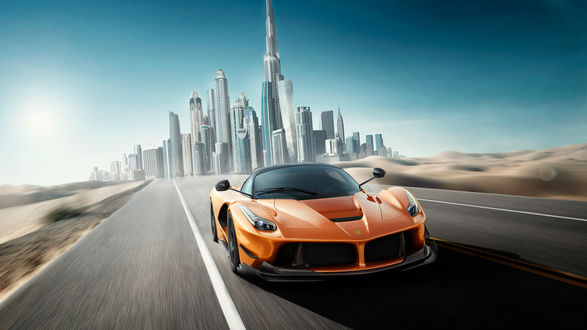 Обои на рабочий стол Авто марки Ferrari La Ferrari мчится меж барханами, 2013 года