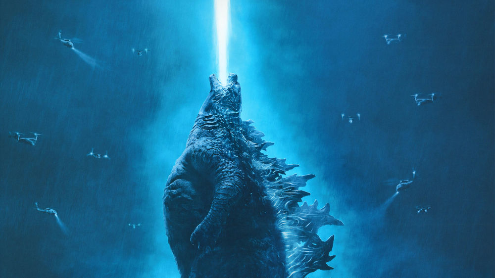 Обои для рабочего стола Godzilla / Годзилла извергает бело-голубое пламя, стоя в окружение вертолетов, постер к фильму Godzilla: King of the Monsters / Годзилла 2: Король монстров