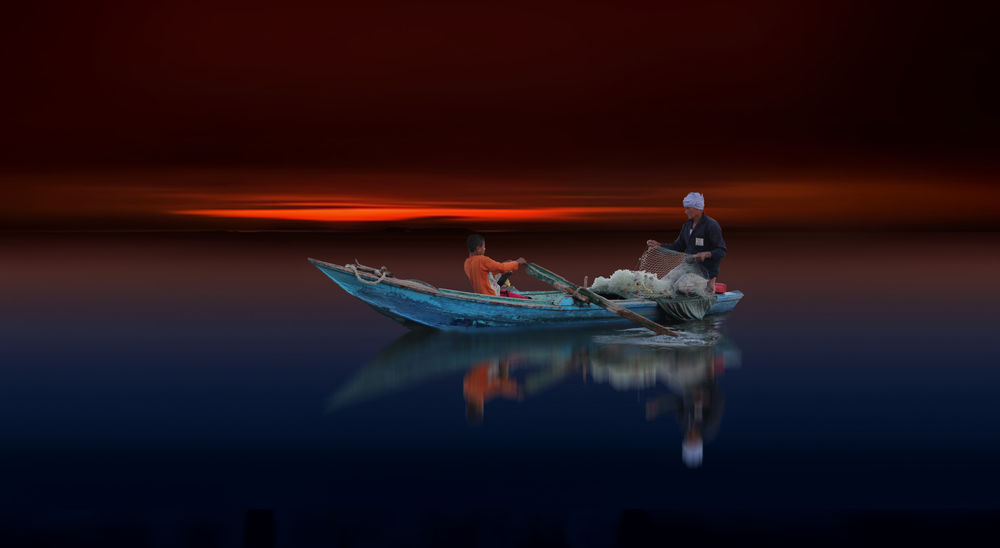 Обои для рабочего стола Мужчины в лодке на воде, by Nasser Osman