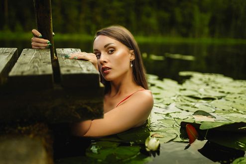 Обои на рабочий стол Девушка в воде у мостика, by Janis Balcuns
