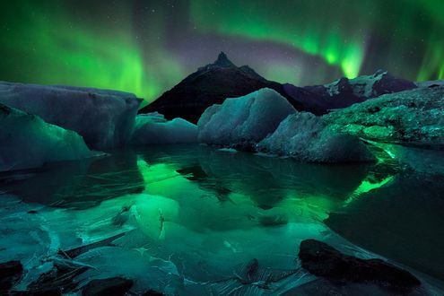 Обои на рабочий стол Северное сияние над ледниками, Исландия, by William Patino