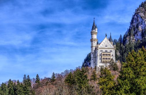 Обои на рабочий стол Замок на фоне леса, гор и неба с облаками, by Markus Distelrath