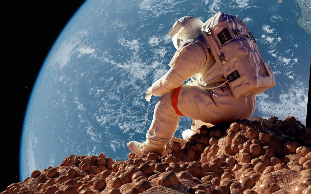 Обои для рабочего стола Астронавт сидит на лунном грунте и смотрит на Землю