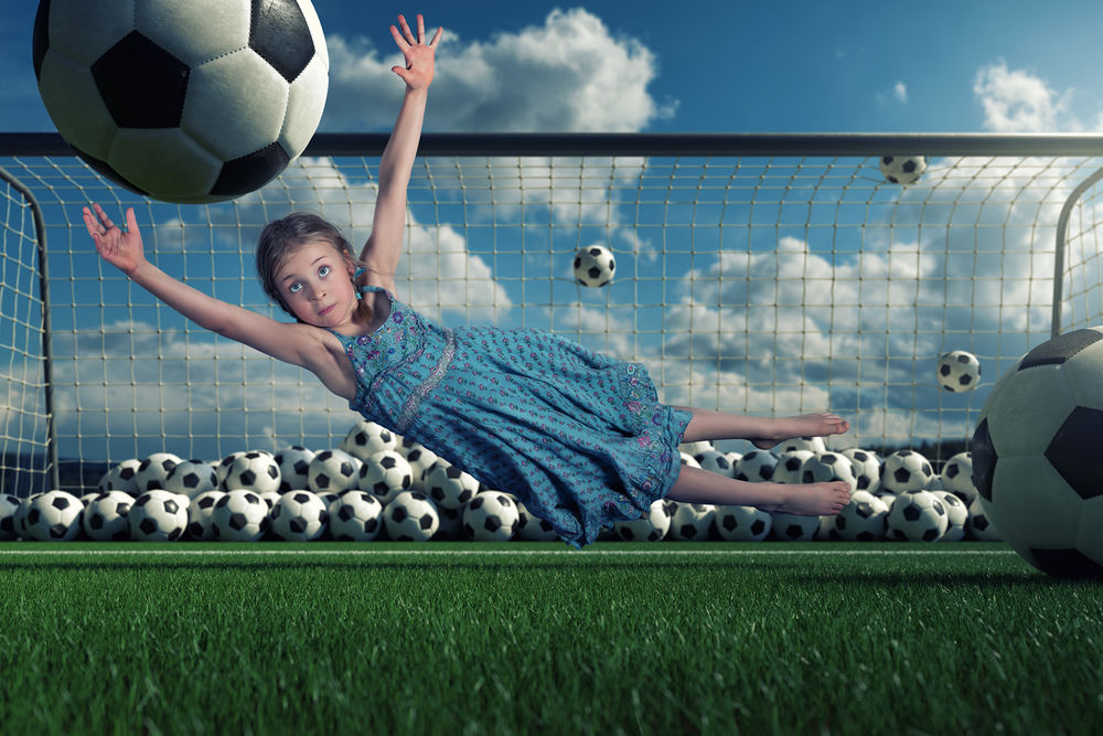Обои для рабочего стола Девочка ловит мяч, летящий в ворота, by John Wilhelm