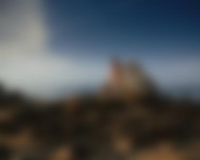 Обои на рабочий стол Обнаженная девушка стоит на камнях, фотограф Юмир Скиба