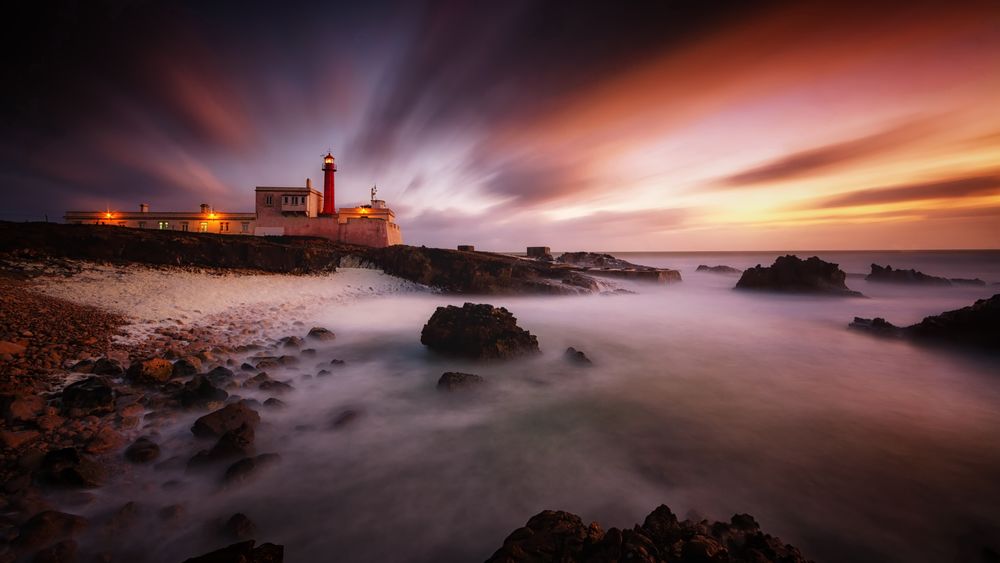 Обои для рабочего стола Маяк Cabo Raso / Кабо Расо на фоне заката солнца, Portugal, Cascais / Португалия, Кашкайш