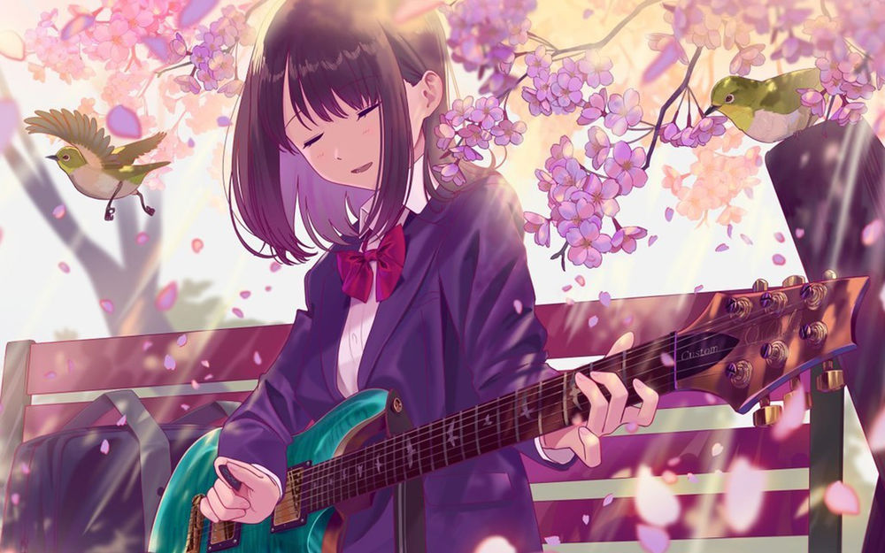 Обои для рабочего стола Девушка с гитарой стоит у цветущего дерева
