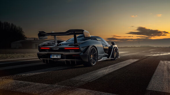 Обои на рабочий стол Mclaren Senna на вечернем треке сзади на закате