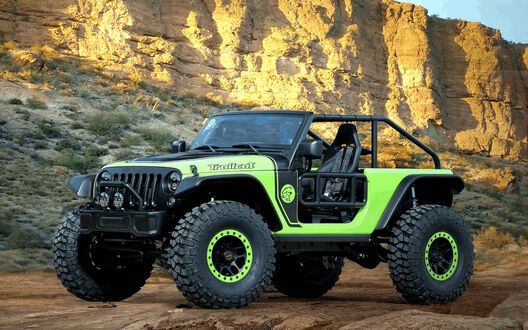 Обои на рабочий стол Зеленый Jeep Wrangler на фоне гор