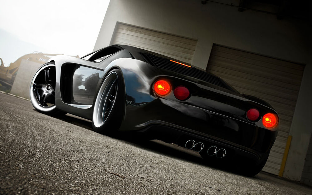Обои для рабочего стола Черный Ford GT 40 dzcp 2005, стоит у гаража, вид сзади