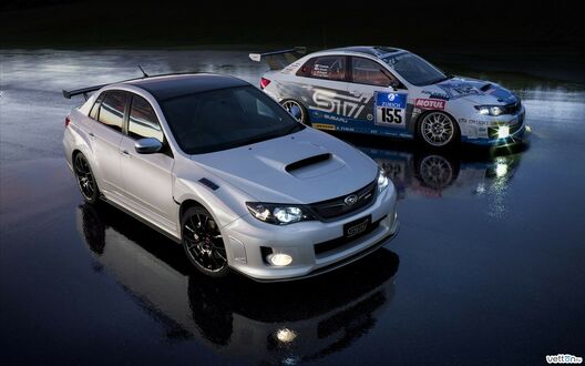 Обои на рабочий стол Две Subaru WRX STI на мокром асфальте