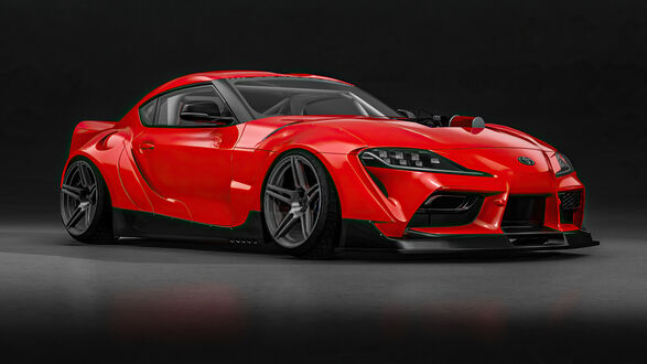 Обои на рабочий стол Красная Toyota Supra на на черном фоне