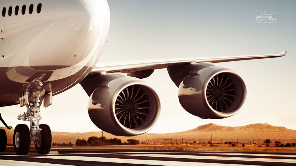 Обои для рабочего стола Дав двигателя под крылом Boeing 747-8 на фоне красной пустыни