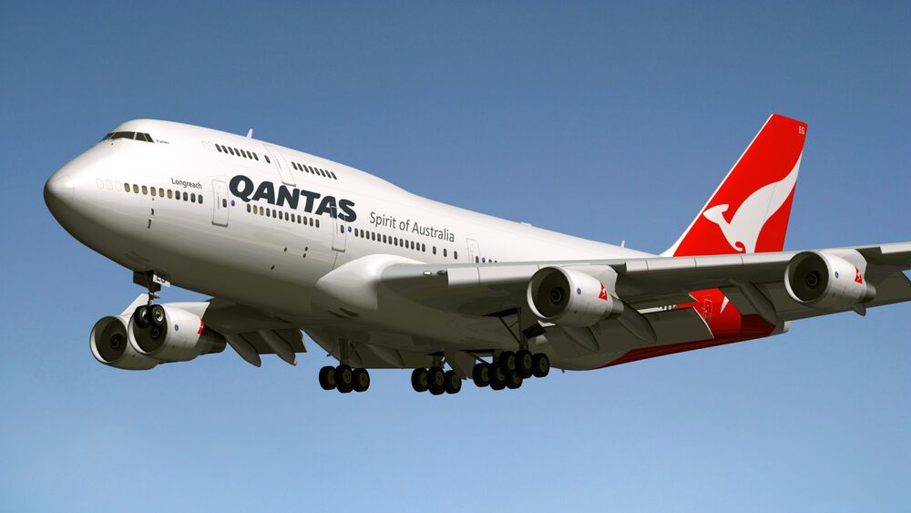 Обои для рабочего стола Боинг 747-438ER / Boeing 747-438ER авиакомпании Qantas взлетел в голубое небо