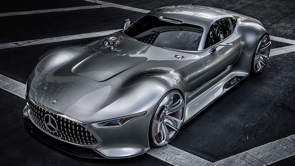 Обои для рабочего стола Серебристый Mercedes Benz AMG Vision Gran Turismo на асфальте