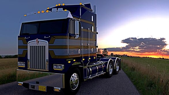 Обои на рабочий стол Грузовик kenworth стоит на дороге в поле