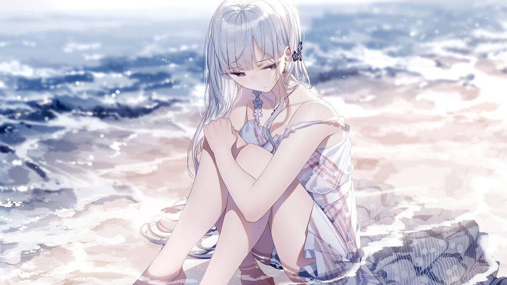 Обои для рабочего стола Грустная девушка сидит на морском берегу