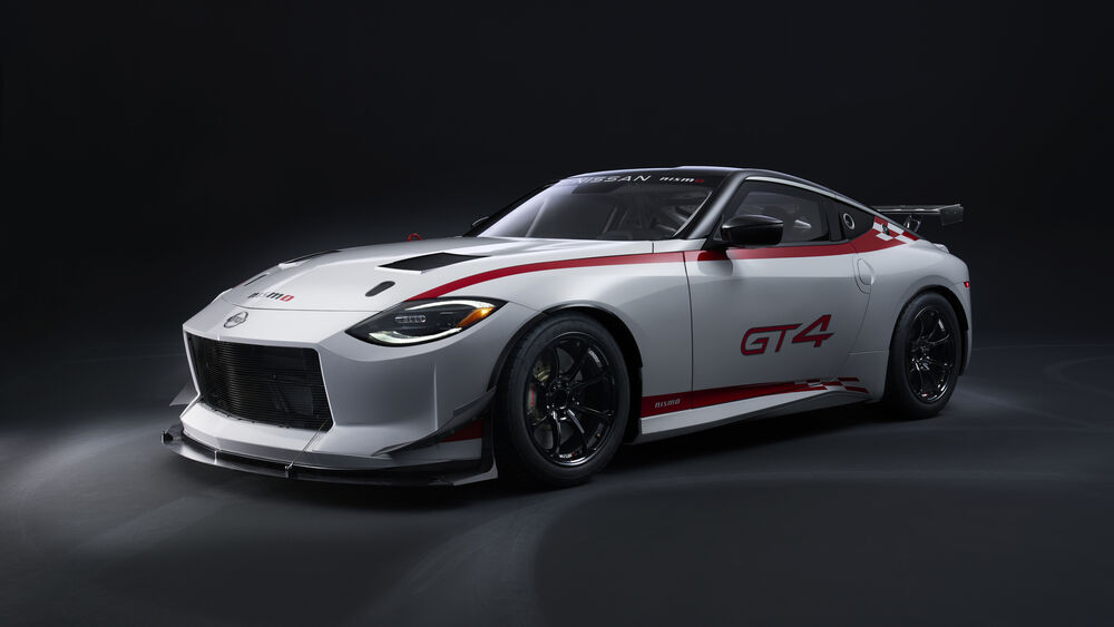 Обои для рабочего стола Белый Nissan GT4 на черном фоне