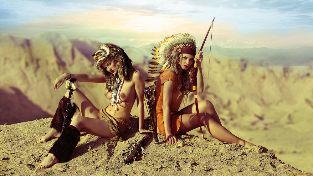 Обои для рабочего стола Девушки с луком и стрелами в одеждах индейского племени сидят на фоне гор, эро-косплей
