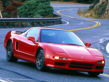 Обои на рабочий стол Красный спортивный автомобиль Acura nsx едет по дороге