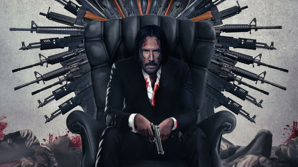 Обои для рабочего стола Keanu Reeves / Киану Ривз в роли John Wick / Джон Уик из одноименного фильма сидит на троне украшенном оружием с пистолетом в руках среди трупов