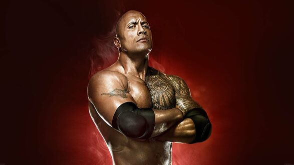 Обои на рабочий стол Скала / The Rock Дуэйн Джонсон / Dwayne Johnson на красном фоне скрестил руки на груди