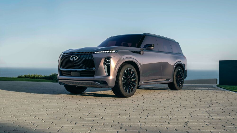 Обои для рабочего стола Темно-серый Infiniti QX Monograph на брусчатке на фоне неба