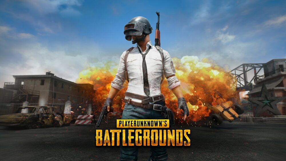 Обои для рабочего стола Мужчина с оружием за спиной на фоне взрыва из игры PlayerUnknowns Battlegrounds