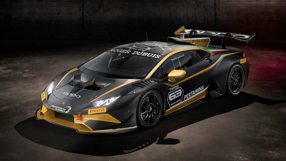 Обои для рабочего стола Черный Lamborghini Huracán в гараже на темном фоне