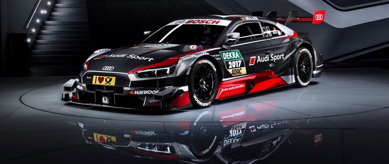 Обои на рабочий стол Гоночный автомобиль Audi RS 5 DTM в черной окраске с яркими логотипами на кузове