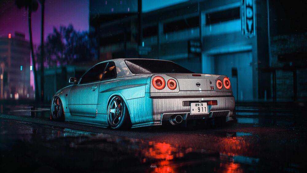 Обои для рабочего стола Серый Nissan Skyline на улице ночного города под дождем