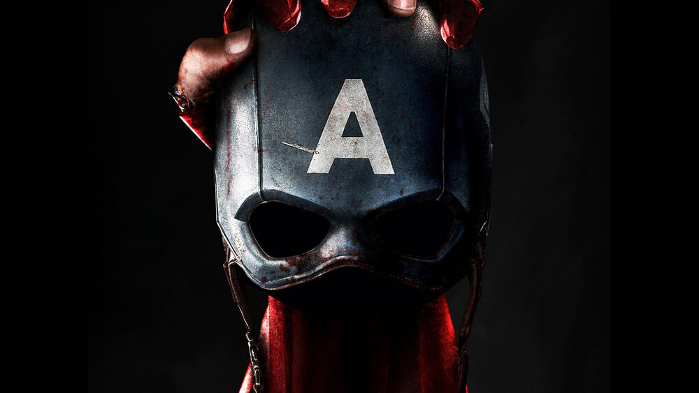 Обои для рабочего стола Шлем Капитана Америка / Captain America с большой буквой А на темно-сером фоне держит красная рука