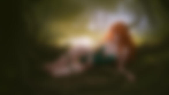 Обои на рабочий стол Рыжеволосая девушка с большой грудью лежит в лесу оплетенная корнями растений