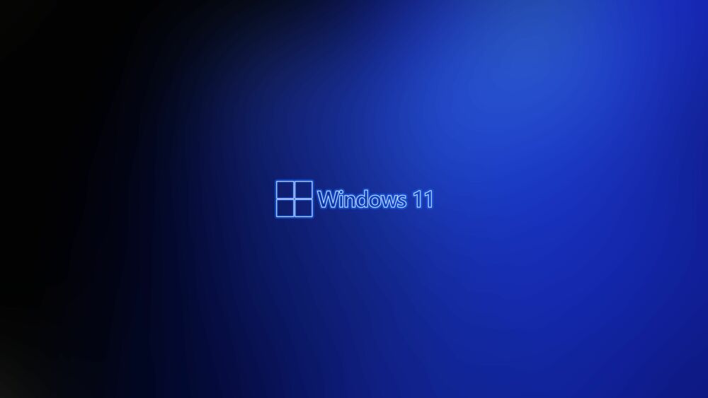 Обои для рабочего стола Логотип Windows 11 светит неоновым светом на темно-синем фоне